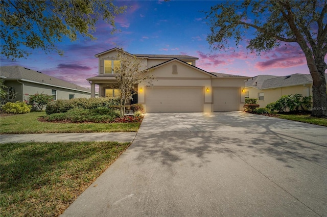6308 Bridgevista Dr, Lithia, FL 33547 - traditional home with stucco siding, a garage, driveway, and a front lawn