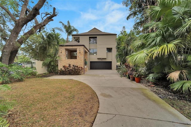 view of front of home with a garage and concrete driveway