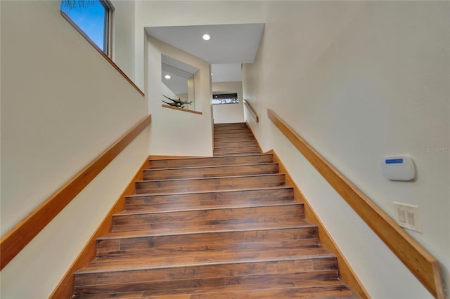 stairs featuring recessed lighting