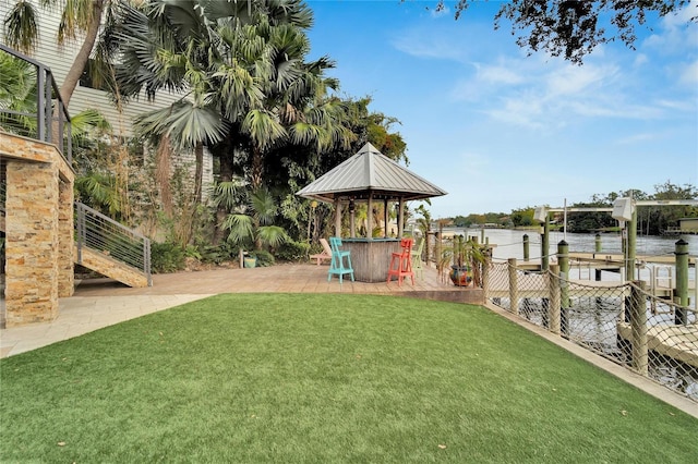 view of yard featuring a water view and a gazebo