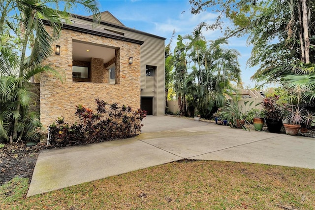 view of property exterior featuring driveway