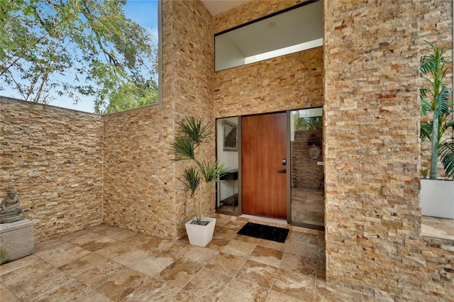 doorway to property with a patio