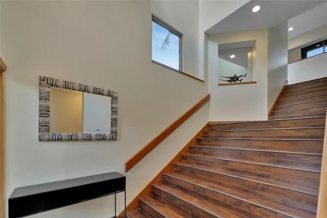 staircase with recessed lighting