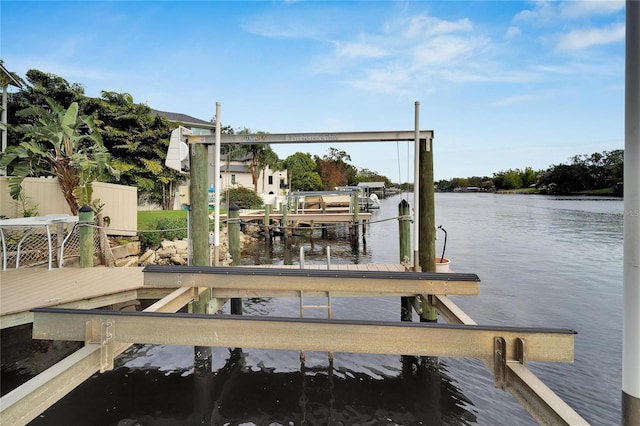 view of dock featuring a water view and boat lift