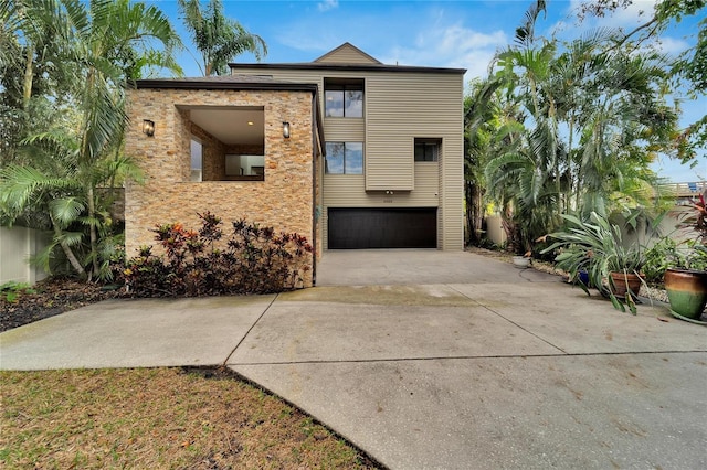 view of front facade with a garage and concrete driveway