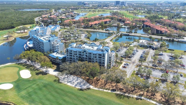 aerial view featuring a water view and view of golf course