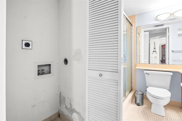 full bathroom featuring a stall shower, tile patterned flooring, visible vents, and toilet