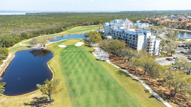 aerial view with view of golf course and a water view