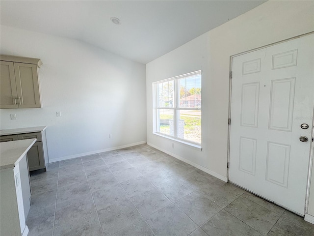 interior space featuring baseboards