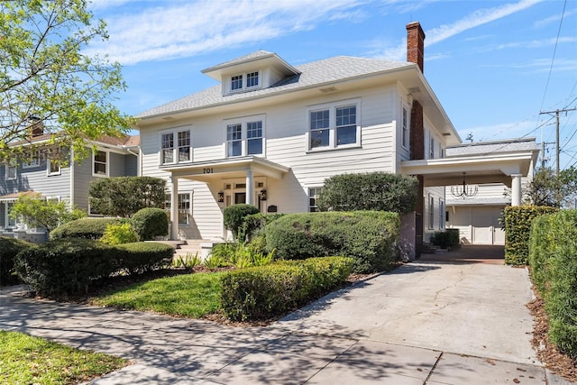 traditional style home featuring a chimney