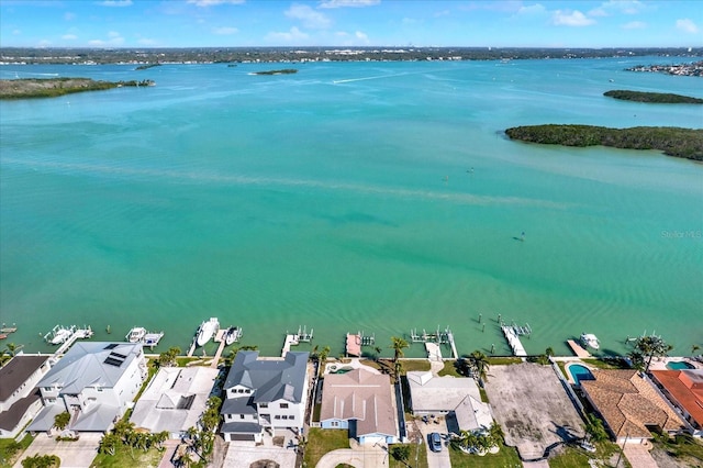 bird's eye view featuring a water view and a residential view