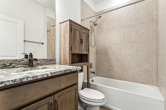 bathroom with shower / bathtub combination, vanity, and toilet