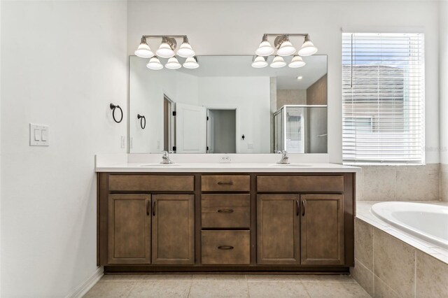 full bath featuring double vanity, a stall shower, a sink, and a bath