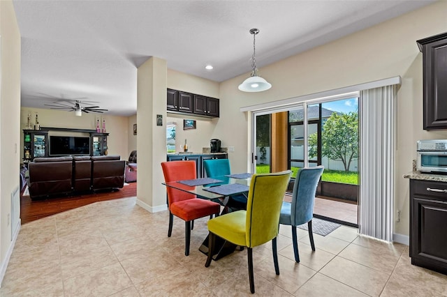 dining space featuring ceiling fan, recessed lighting, light tile patterned flooring, and baseboards