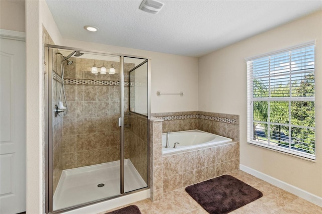 full bath featuring a garden tub, a shower stall, visible vents, and a textured ceiling