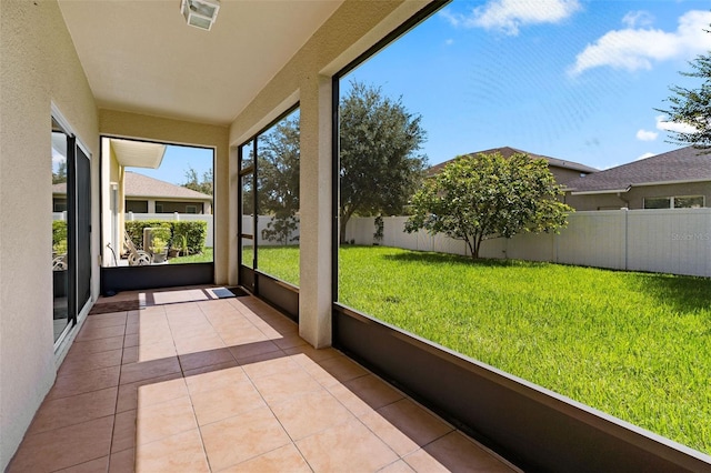 unfurnished sunroom featuring visible vents