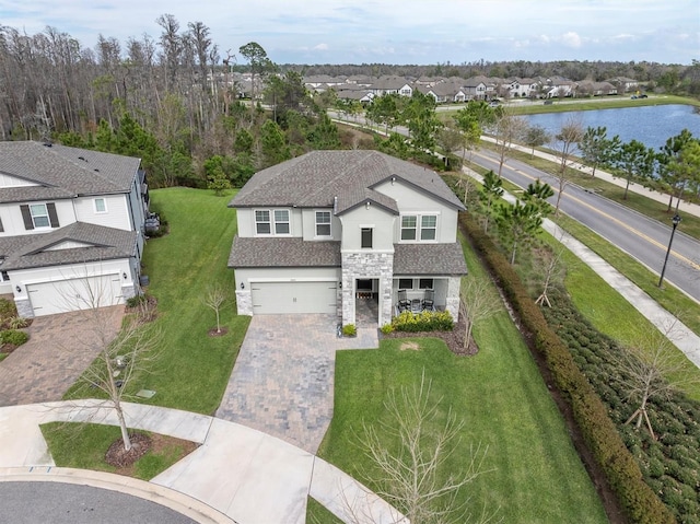 bird's eye view featuring a water view and a residential view