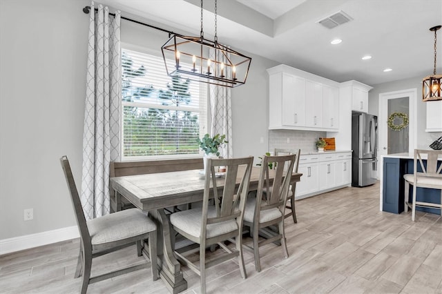 dining space featuring light wood-style floors, baseboards, visible vents, and recessed lighting