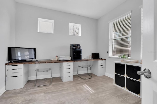 office featuring light wood-style flooring and baseboards