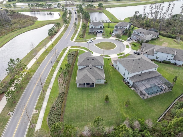 birds eye view of property featuring a residential view and a water view