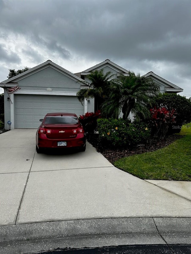 view of front of property featuring driveway and an attached garage