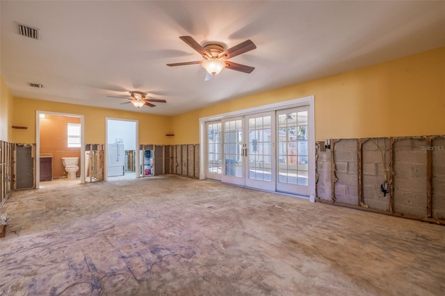 unfurnished living room featuring french doors, plenty of natural light, visible vents, and a ceiling fan