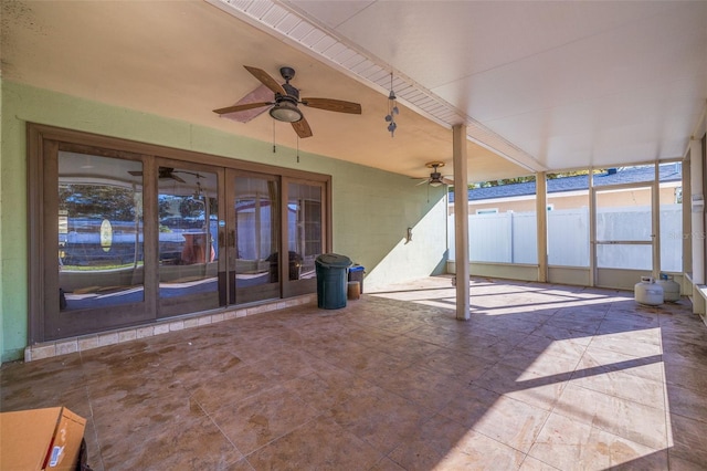 view of patio featuring a ceiling fan, french doors, and fence