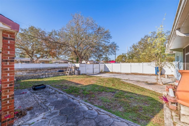 view of yard featuring a fenced backyard and a patio