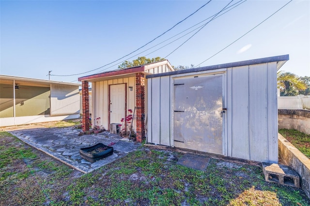 view of shed with fence