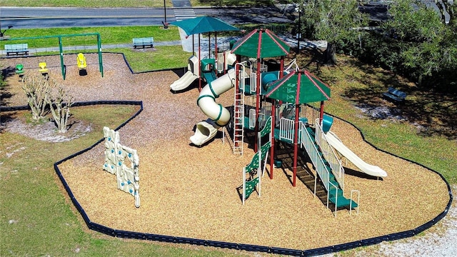 communal playground featuring a lawn