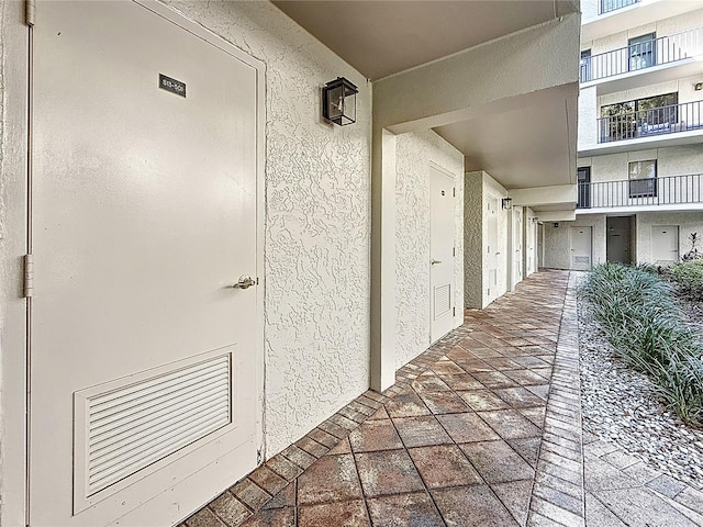 property entrance featuring stucco siding