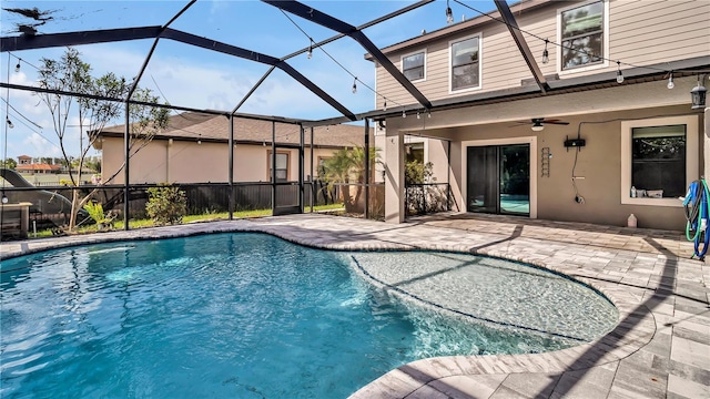 outdoor pool featuring a patio, a lanai, and ceiling fan