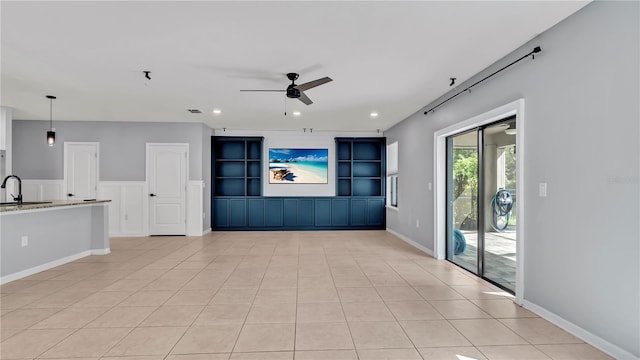 unfurnished living room with visible vents, recessed lighting, light tile patterned flooring, a ceiling fan, and a sink