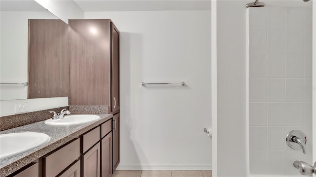 full bathroom with a sink, shower / bathing tub combination, double vanity, and tile patterned floors