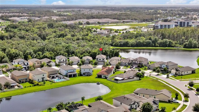 bird's eye view with a residential view and a water view