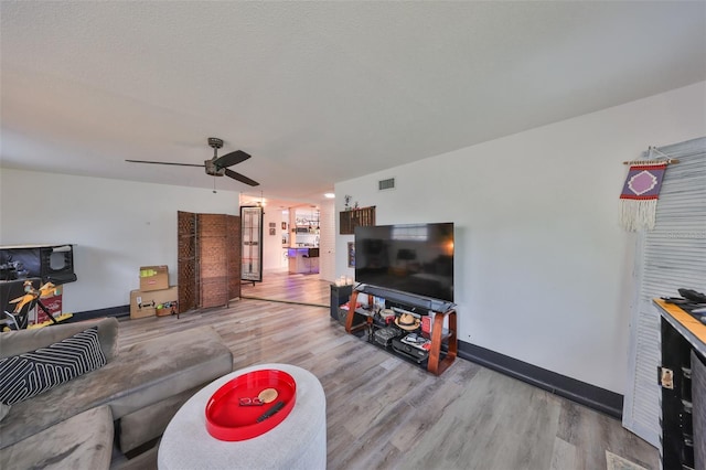 5601 2nd Ave N, Saint Petersburg, FL 33710 - living area with a ceiling fan, visible vents, baseboards, and wood finished floors