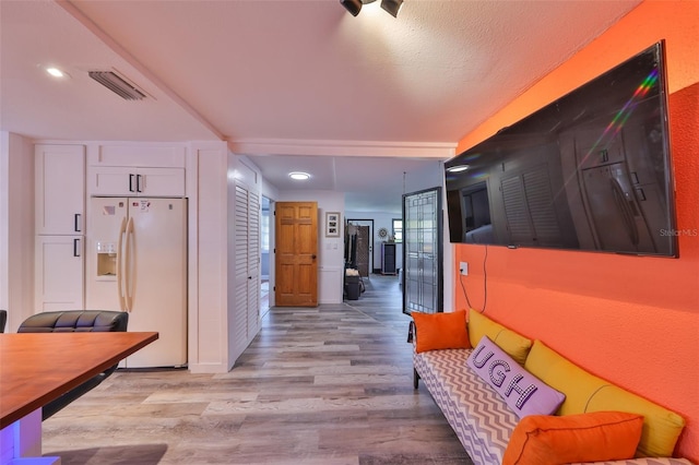 5601 2nd Ave N, Saint Petersburg, FL 33710 - hallway with light wood-style floors, visible vents, and recessed lighting