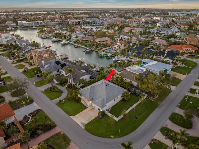 aerial view featuring a residential view and a water view