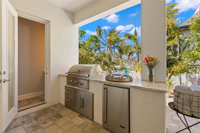 view of patio / terrace featuring an outdoor kitchen and area for grilling