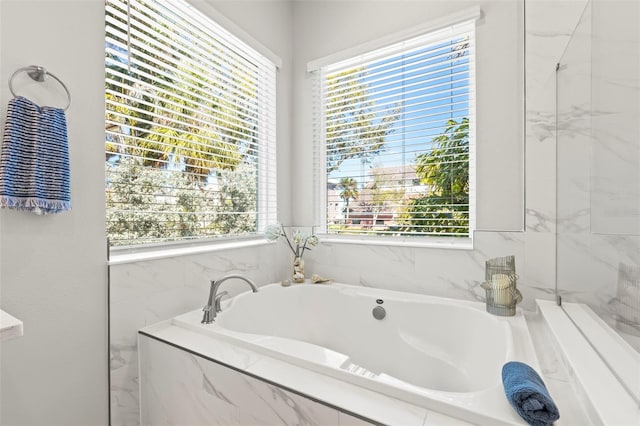 bathroom featuring a garden tub