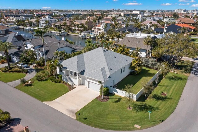 aerial view with a water view and a residential view