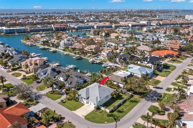 birds eye view of property featuring a residential view and a water view