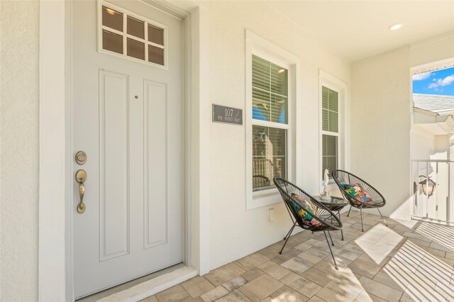 property entrance featuring stucco siding