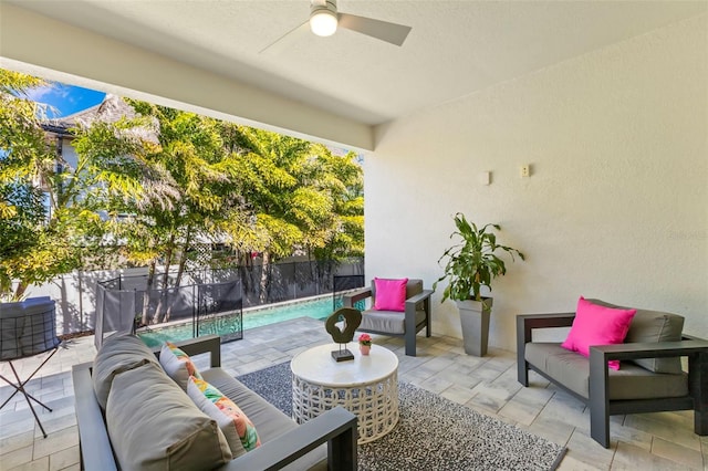 view of patio featuring ceiling fan, an outdoor hangout area, and fence