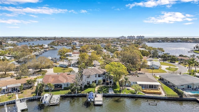 birds eye view of property with a water view and a residential view