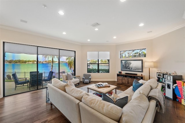 living area with visible vents, dark wood-style flooring, and ornamental molding