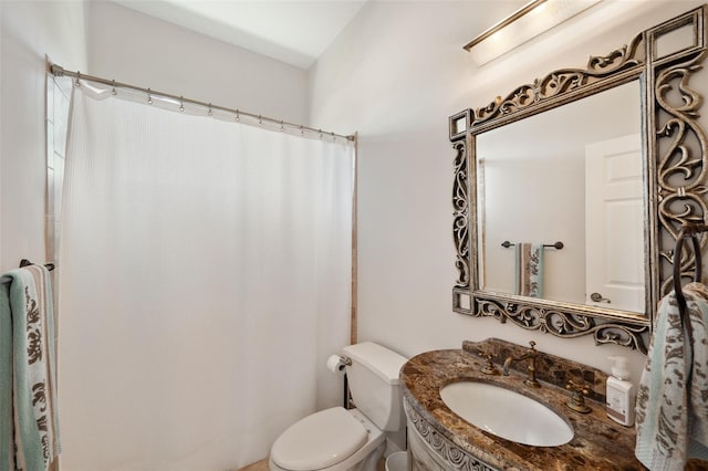 bathroom with vanity, toilet, and a shower with curtain