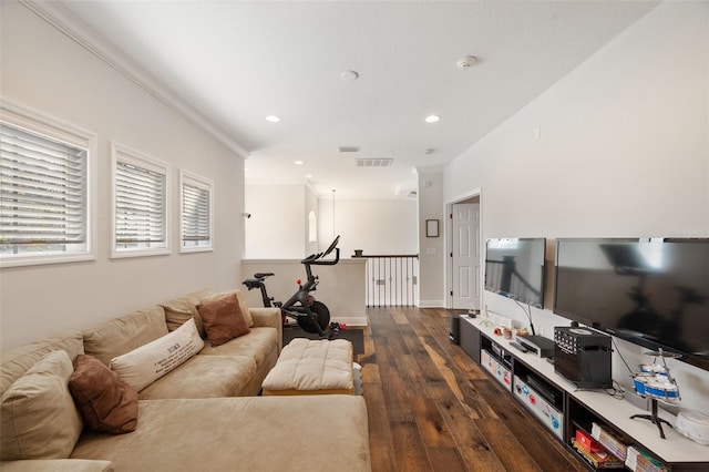 living area with recessed lighting, dark wood-style flooring, visible vents, and baseboards