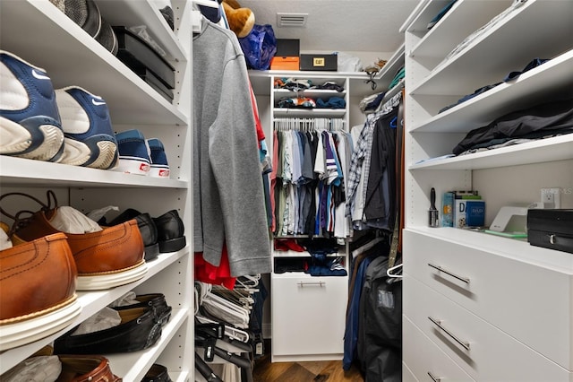 spacious closet with wood finished floors and visible vents