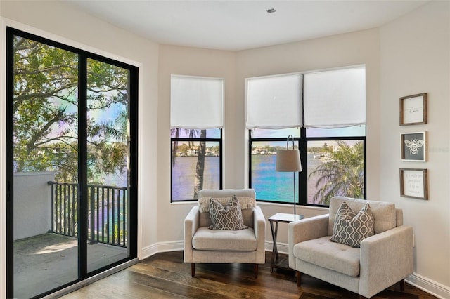 sitting room featuring wood finished floors and baseboards